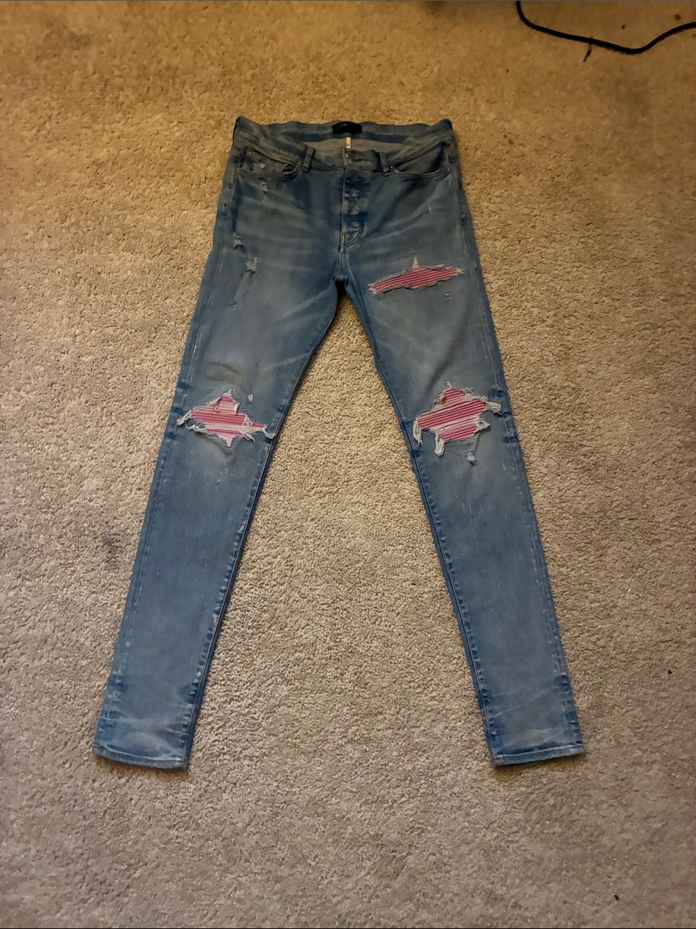 AMIRI Light Blue Skinny Jeans with Pink Patch Distress